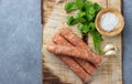 Raw uncooked meat sausages and green herbs Royalty Free Stock Photo