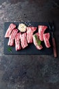 Raw uncooked pork ribs, fresh meat on dark metal background. Top view Royalty Free Stock Photo