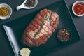 Raw Uncooked Pork, Rolled Meat with Herbs and Seasoning Royalty Free Stock Photo