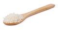 Raw and uncooked rice in wooden spoon Royalty Free Stock Photo