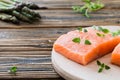 Raw uncooked salmon and vegetables on wooden table Royalty Free Stock Photo