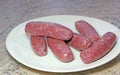 Raw or uncooked sausages.