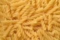 Raw uncooked spiral pasta background Royalty Free Stock Photo