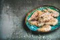 Raw uncooked tiger prawns on chipped ice, concrete background Royalty Free Stock Photo