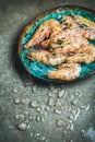 Raw uncooked tiger prawns on chipped ice in tray Royalty Free Stock Photo