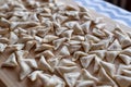 Raw, uncooked triangle shaped manti. traditional turkish food. turkish ravioli