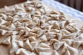 Raw, uncooked triangle shaped manti. traditional turkish food. turkish ravioli