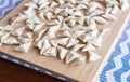 Raw, uncooked triangle shaped manti. traditional turkish food. turkish ravioli