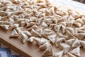 Raw, uncooked triangle shaped manti. traditional turkish food. turkish ravioli