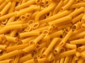 raw uncooked yellow italian pasta as background