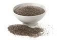 Raw, unprocessed, dried black chia seeds in white bowl on white