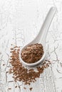 Raw, unprocessed linseed or flax seed in scoop on table