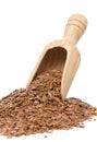 Raw, unprocessed linseed or flax seed in wooden scoop