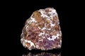 Raw and unrefined copper pyrites or chalcopyrite in front of black background