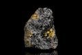 Raw and unrefined manganese ore in front of black background