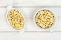 Raw unsalted cashew on grey wood