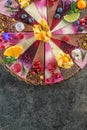 Raw vegan cakes with fruit and seeds, decorated with flower, product photography for patisserie Royalty Free Stock Photo