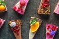 Raw vegan cakes with fruit and seeds, decorated with flower, product photography for patisserie