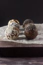 Raw vegan healthy energy balls with oatmeal, chia seed, coconut flakes, cocoa and dried fruits Royalty Free Stock Photo