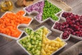 Vegan salad in the form of jigsaw puzzles from plates with different vegetables. Royalty Free Stock Photo