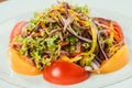 Fresh vegetables sliced on white plate