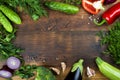 Raw vegetables on wooden texture background with copyspace in center