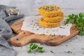 Raw veggie burger with chickpeas vegetables and parsley leaves on kitchen countertop Royalty Free Stock Photo