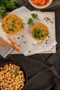 Raw veggie burger with chickpeas vegetables and parsley leaves on kitchen countertop Royalty Free Stock Photo