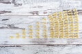 Raw vehicle-shaped pasta in pile on wooden table Royalty Free Stock Photo