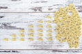 Raw vehicle-shaped pasta in pile on wooden table Royalty Free Stock Photo