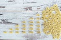Raw vehicle-shaped pasta in pile on wooden table Royalty Free Stock Photo