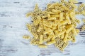 Raw vehicle-shaped pasta in pile on wooden table Royalty Free Stock Photo