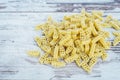 Raw vehicle-shaped pasta in pile on wooden table Royalty Free Stock Photo