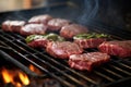 raw venison steaks on grill before cooking process Royalty Free Stock Photo