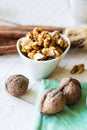 Raw walnuts in a white bowl, white background Royalty Free Stock Photo