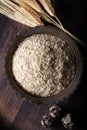 Raw wheat germ in the metal bowl on wooden background. Royalty Free Stock Photo