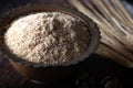 Raw wheat germ in the metal bowl on wooden background. Royalty Free Stock Photo