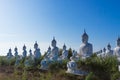 raw of white buddha status on blue sky background Royalty Free Stock Photo