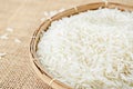 Raw white rice in wood weave basket.