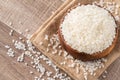Raw white rice in a wooden bowl over table Royalty Free Stock Photo