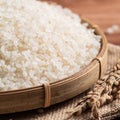 Raw white rice in a wooden bowl over table Royalty Free Stock Photo