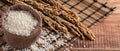 Raw white rice in a wooden bowl over table Royalty Free Stock Photo