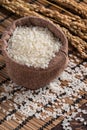 Raw white rice in a wooden bowl over table Royalty Free Stock Photo