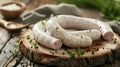 Raw white sausages with herbs on wooden board Royalty Free Stock Photo