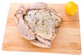 Raw whole chicken on a cutting board Royalty Free Stock Photo