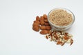 Ground, crushed and whole almonds on white background. Royalty Free Stock Photo