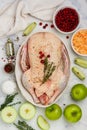 Raw whole duck for baking with apples, cranberries, sauerkraut and spices Royalty Free Stock Photo