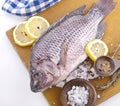 Raw Whole Fish on a cutting board Royalty Free Stock Photo