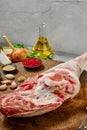 Raw whole lamb leg chump on with ingredients closeup Royalty Free Stock Photo