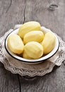 Raw whole peeled potatoes in bowl Royalty Free Stock Photo